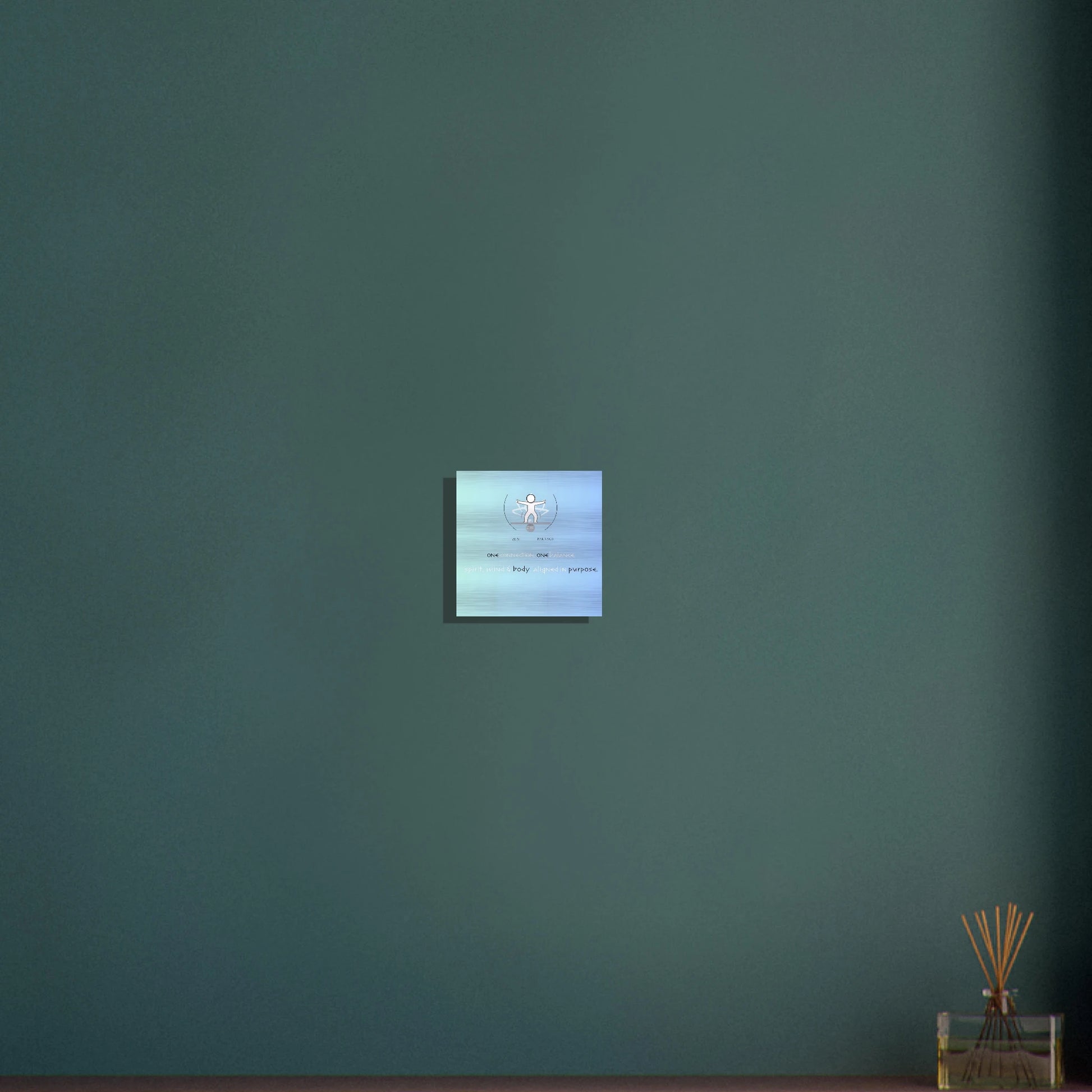 Square wall-mounted screen displaying a blue and white pattern on a teal wall.