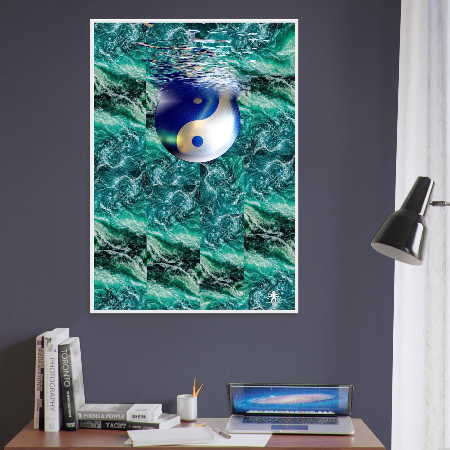 Framed artwork of a yin yang symbol in water on a wall above a desk.