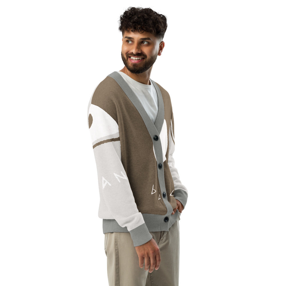 Man wearing a brown and gray cardigan with white sleeves on a white background